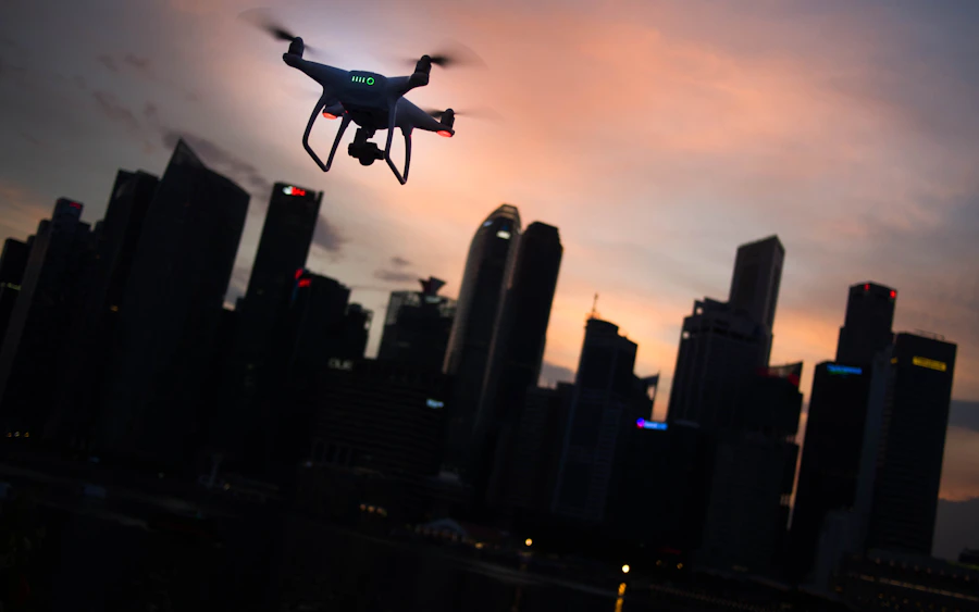 Drone silhouette flying over a city skyline at dusk