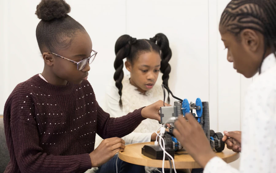 Students assembling a robotics kit together